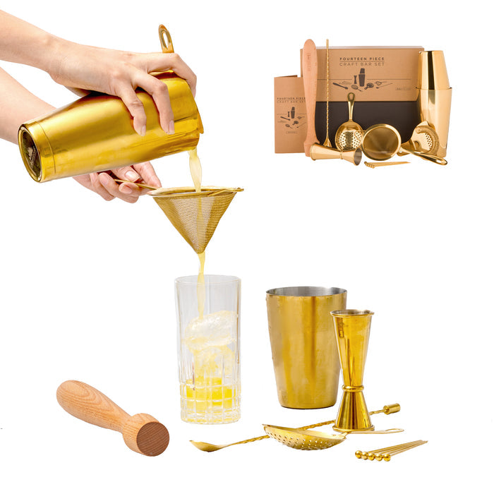 Gold 14-piece bartender kit shown with a hand pouring a cocktail, alongside various gold tools and a wooden muddler.