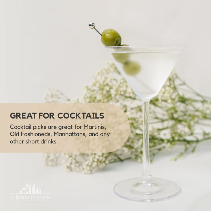 Graphic highlighting the Stainless Steel Cocktail Picks' versatility for various cocktails, shown with a martini and olives (details in description).