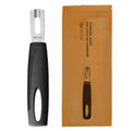 Stainless steel channel knife with black handle, displayed upright beside its brown retail packaging.