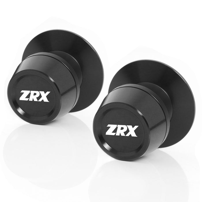 Black Kawasaki ZRX1200 R swingarm spools with engraved MC Motoparts logo, designed for 10mm swingarm mounting.
