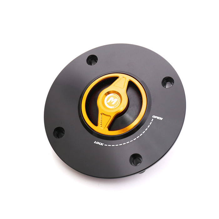 CNC metal quick lock fuel cap for Suzuki GSX-R1000 and GSXR750 motorcycles, branded MC Motoparts, with a gold finish.