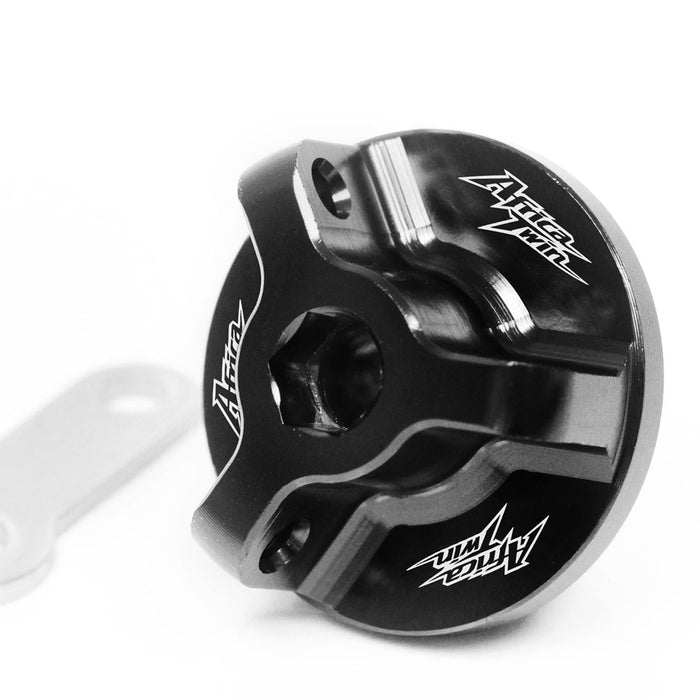 Black engraved oil filler cap for Honda Africa Twin CRF1000L DCT 2016-2019 by MC Motoparts, featuring logo detail.