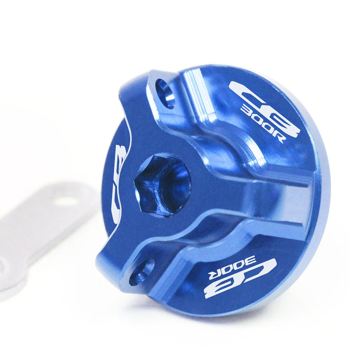 Honda CB300R 2012-2024 oil filler cap by MC Motoparts with engraved logo, featuring a blue finish and durable metal construction.
