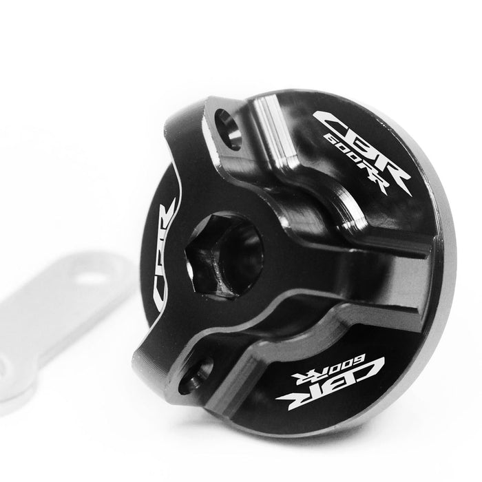 Black Honda CBR600RR oil filler cap with engraved MC Motoparts logo, designed for 2007-2025 ABS models.