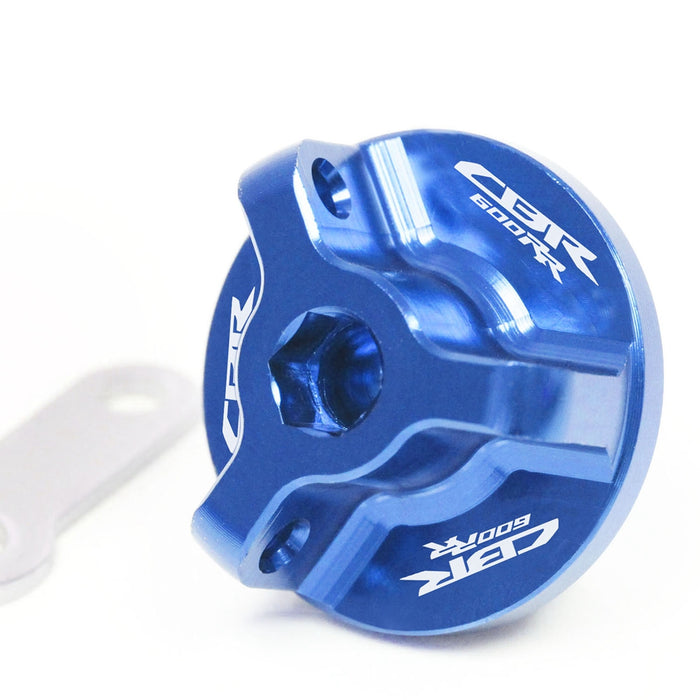 Honda CBR600RR oil filler cap with engraved logo, blue MC Motoparts brand, fits models 2007-2025, featuring a durable design.