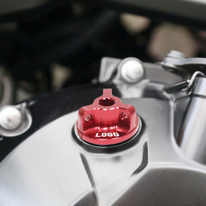 Honda MSX 125 GROM 2014-2025 engraved logo oil filler cap by MC Motoparts installed on motorcycle engine.
