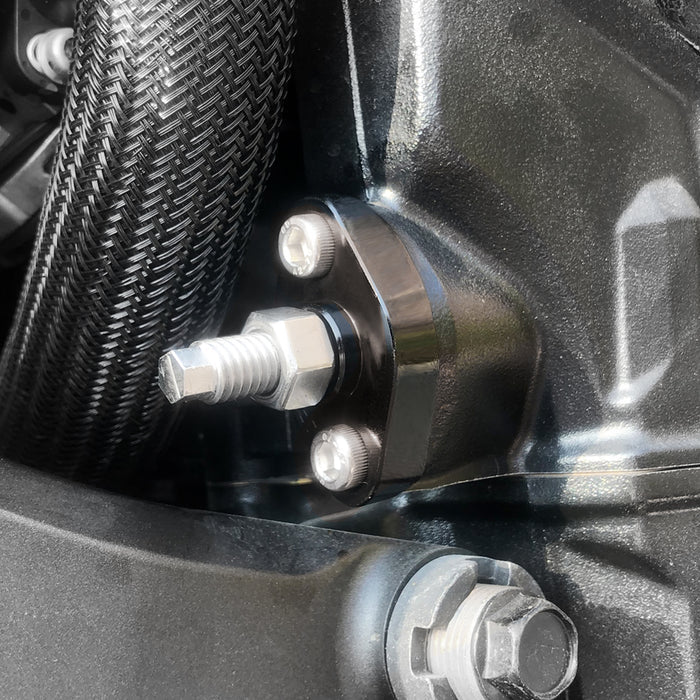 MC Motoparts cam chain tensioner for Kawasaki KLX 400 and KFX 400, manual type, installed on motorcycle engine.