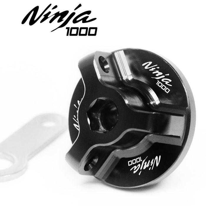 MC Motoparts logo engraved oil filler cap for Kawasaki Ninja 1000 Z1000SX 2010-2025, black metal with detailed logo engraving.