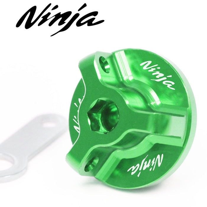 Kawasaki Ninja 650R oil filler cap with engraved Ninja logo by MC Motoparts, designed for Kawasaki ER-6F and 650 models.