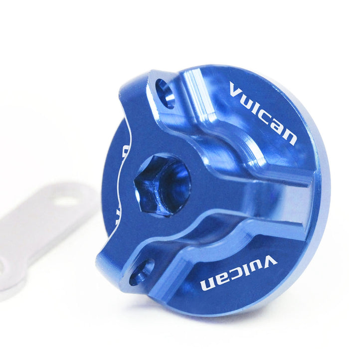 Kawasaki Vulcan S 650 oil filler cap by MC Motoparts with engraved logo, blue finish, fits 2014-2025 EN650 models.