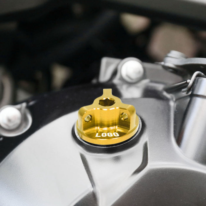 Kawasaki Z650 2017-2025 oil filler cap with engraved logo by MC Motoparts, showing the metallic cap installed on the motorcycle engine