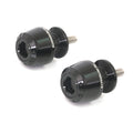 Black MC Motoparts swingarm spools for Suzuki GSX250R, GSXR125, GSXS1000, 8mm paddock stand mounts on motorcycle swingarm.