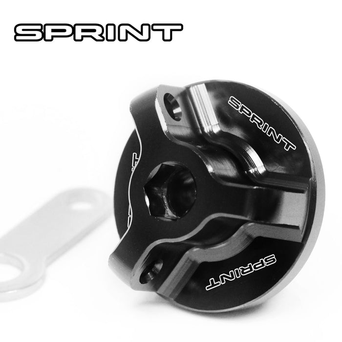 Black engraved oil filler cap for Triumph Sprint ST and RS models by MC Motoparts, featuring logo design and durable metal construction.