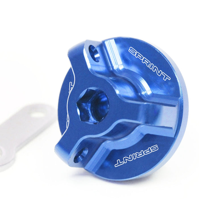 MC Motoparts engraved logo oil filler cap for Triumph Sprint ST 99-10 and Sprint RS 955 99-04 motorcycle, with blue finish.