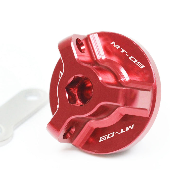 Red engraved oil filler cap for Yamaha FZ-09 MT-09 Tracer 2014-2026, by MC Motoparts, shown on motorcycle engine.