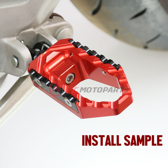 Front view of MC Motoparts touring thick wide foot pegs for Ducati Monster 821 and 1200 TRC, designed for comfortable riding.