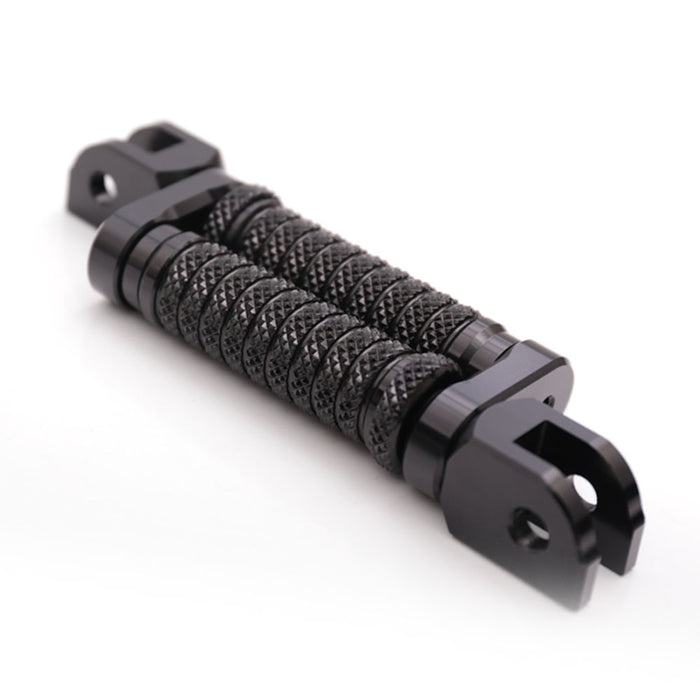 Black 25mm extension foot pegs for Honda CB500F, CB600F, CB1000R motorcycle, designed by MC Motoparts, shown from the front.