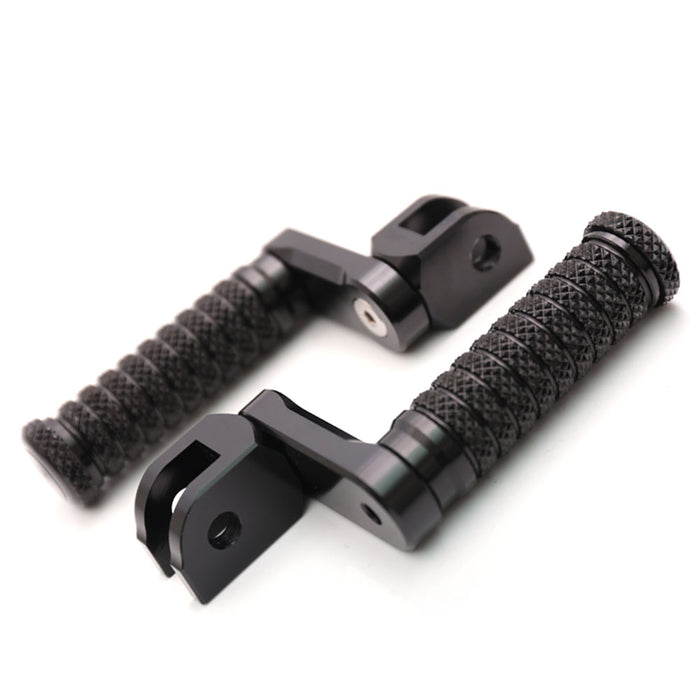 Black 40mm extension foot pegs for Kawasaki Ninja 650R, 300R, 250R, and 1000, designed for improved rider comfort.
