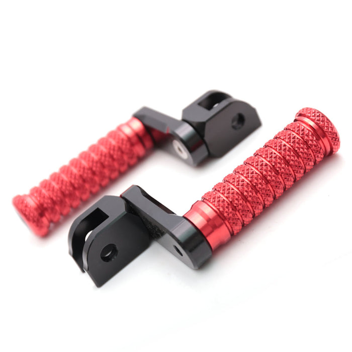 Front view of MC Motoparts 40mm extension foot pegs for Kawasaki Ninja 650R, 300R, 250R, and 1000 motorcycle models.