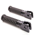 Black MC Motoparts front standard foot pegs for Triumph Scrambler, Speed Triple, Sprint GT motorcycles, shown from the side.