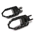 Black MC Motoparts touring wide foot pegs for Yamaha XJR1300, XJ6 Diversion, and TRC touring motorcycle with sturdy metal construction.