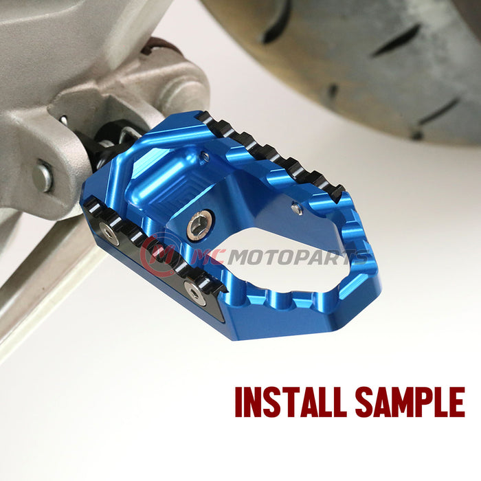 MC Motoparts touring wide front foot pegs for Yamaha YZF R1, R1M, R3, R6 motorcycle, standard foot pegs installed on bike.