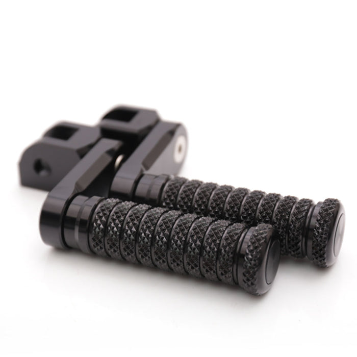 Black 40mm extension foot pegs for Yamaha YZF R1 R3 R6 R25 R125 by MC Motoparts, shown installed on motorcycle.