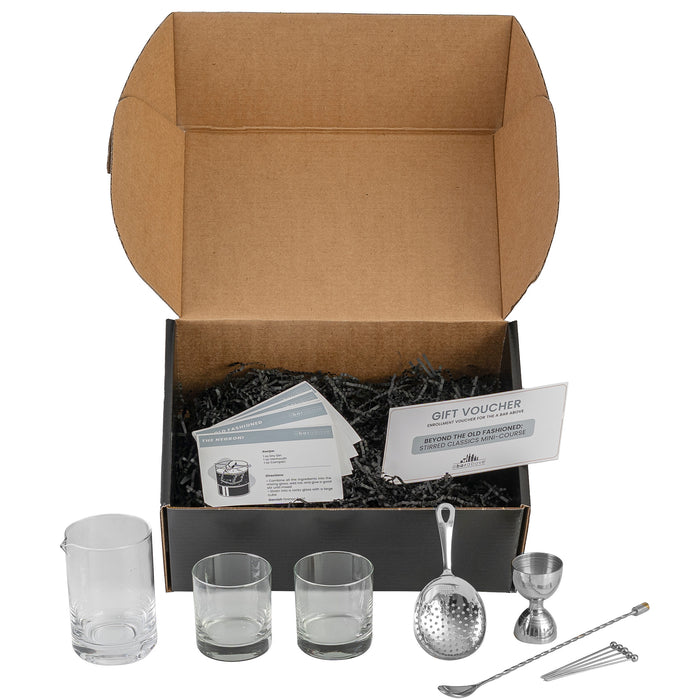 Labeled graphic of the Old Fashioned Gift Box contents, including cocktail tools, clear glasses, recipe cards, and a gift voucher, with details in description.
