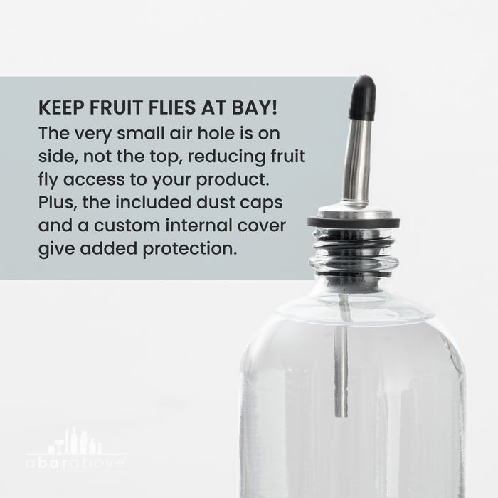 Labeled graphic showcasing a stainless steel pour spout for alcohol bottles, detailing features for fruit fly protection (details in description).