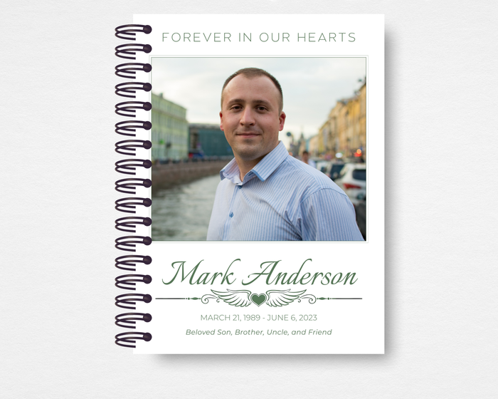 Quiet Classic memorial guest book front cover — white background with full-bleed rectangular photo placeholder, "Forever in Our Hearts" header in sage green caps, script name and dates, winged heart divider, and italic relationship line — Standard size