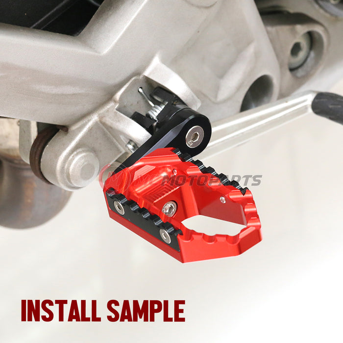Rear 40mm extension touring foot pegs for Aprilia Tuono V4R by MC Motoparts, black wide foot pegs for comfortable riding.