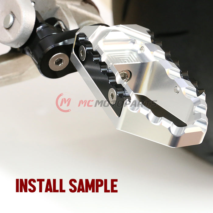 Ducati 899 Panigale rear MC Motoparts 25mm adjustable touring wide foot pegs installed on motorcycle.