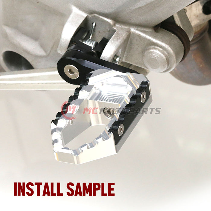 Rear 40mm extension touring foot pegs for Honda CB1100 CB500X by MC Motoparts, wide design for comfortable riding.