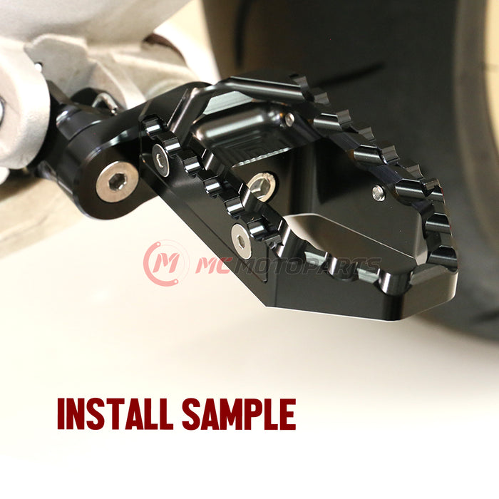 Rear 25mm extension touring wide foot pegs for Honda CBR1000RR and CBR600RR, black MC Motoparts motorcycle accessories.