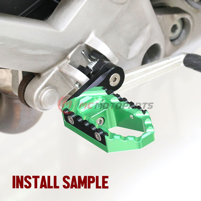 Rear 40mm adjustable touring wide foot pegs for Kawasaki Z750 Z1000, black MC Motoparts extension foot pegs with mounting hardware.