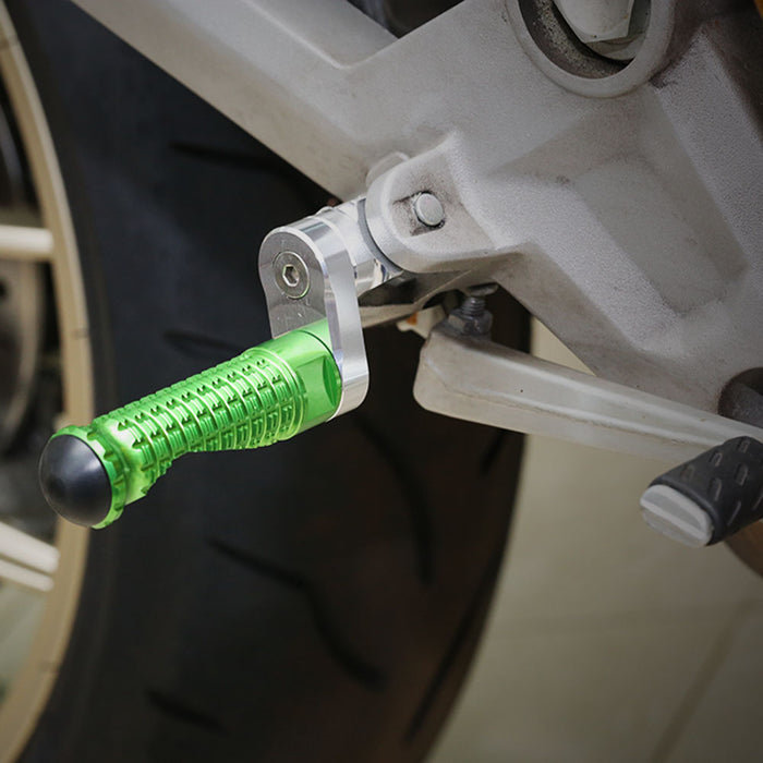 Rear 25mm extension foot pegs for Kawasaki Z750 Z650 Z1000 by MC Motoparts, shown installed on motorcycle.