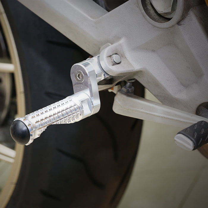 Rear 25mm extension foot pegs for Kawasaki ZX-6R ZX-9R Ninja 650 by MC Motoparts, showing installed metal foot pegs on motorcycle.