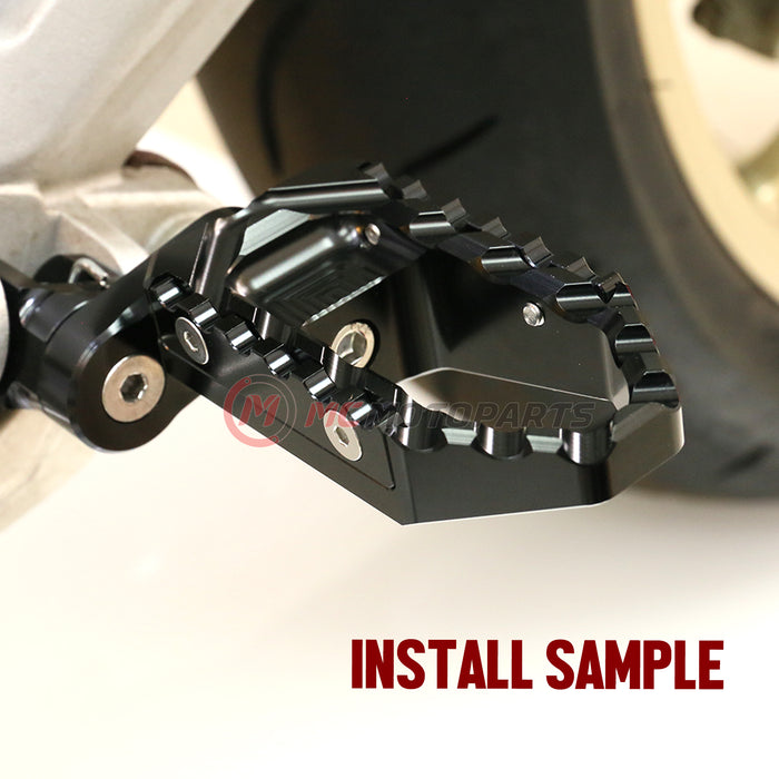 Kawasaki ZX-9R Ninja 650 rear 25mm adjustable touring wide foot pegs by MC Motoparts installed on motorcycle.