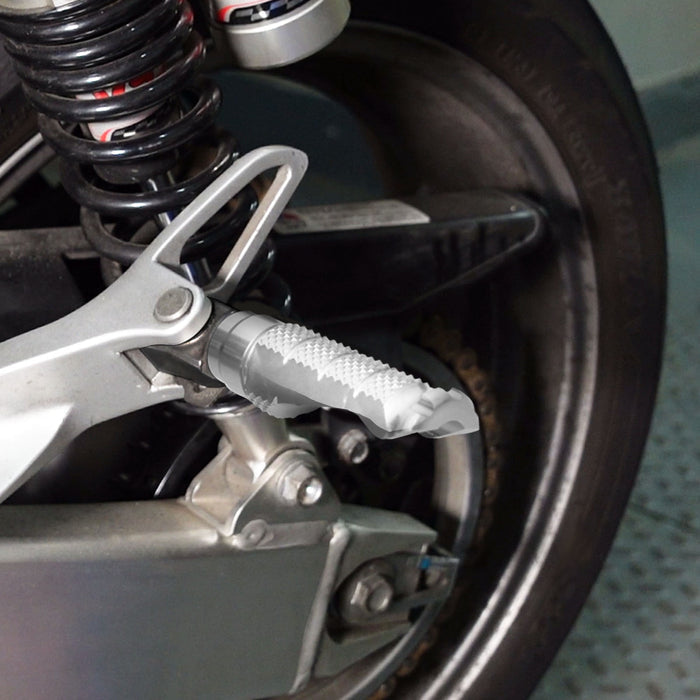 Rear MC Motoparts foot pegs for Suzuki GSX-R 600 750 1000 and Hayabusa motorcycle, showing installation on the bike.