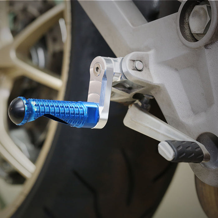 Rear 40mm extension foot pegs for Yamaha XMAX TMAX 530 by MC Motoparts, showcasing their sturdy metal construction and installation.