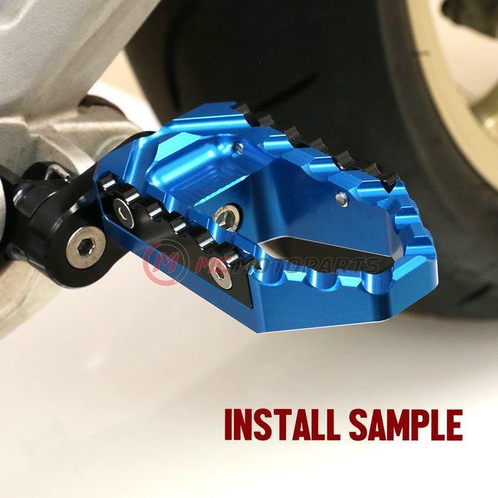 Rear 25mm extension foot pegs for Yamaha XMAX VMAX by MC Motoparts, showing black touring wide foot pegs installed on motorcycle.
