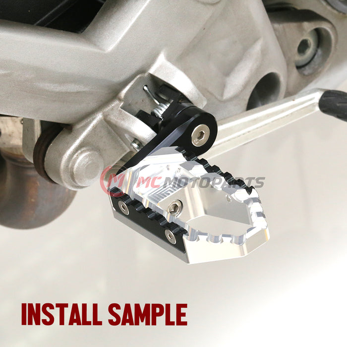 Rear 40mm extension touring foot pegs for Yamaha YZF R6 R3 R1 R25 by MC Motoparts, with black finish and wide design.
